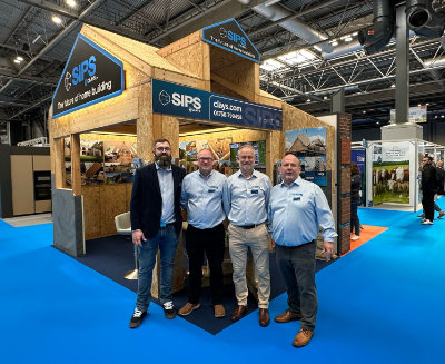 A photo of the SIP@Clays team in front of their bespoke-built show stand